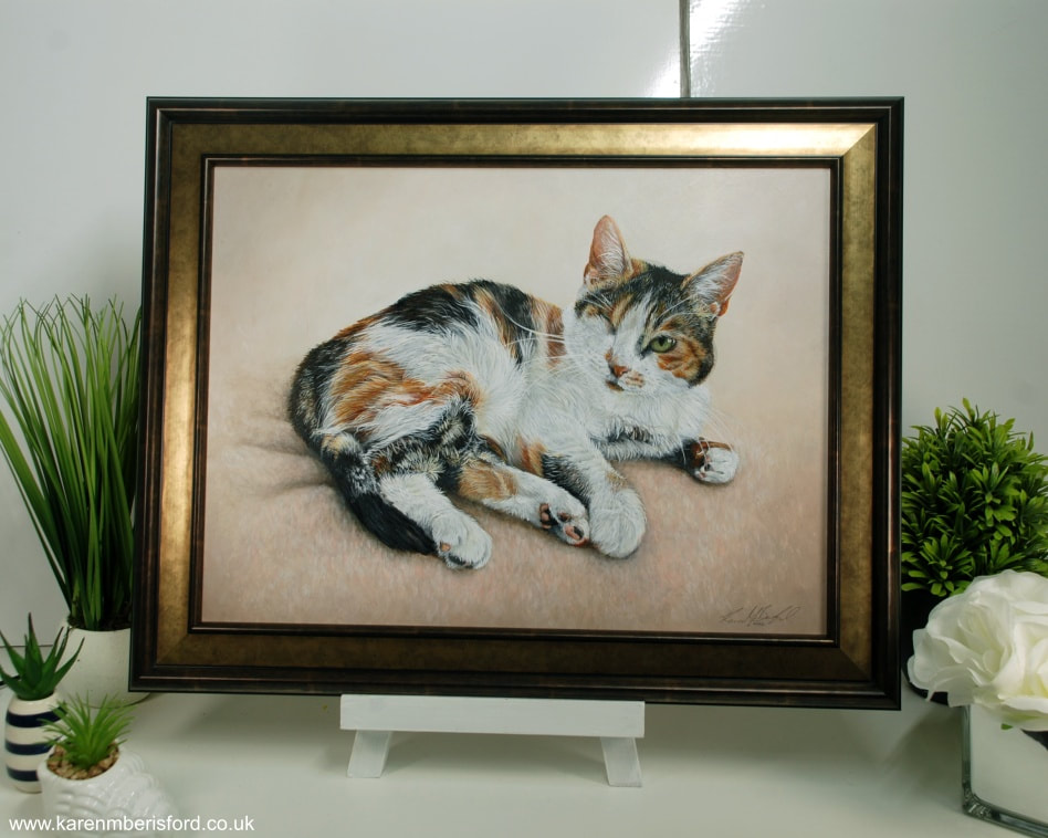 windermere bronze moulding with painting of a Calico shorthaired cat