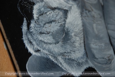 Close up detail of an acrylic painting of a white Boxer pup
