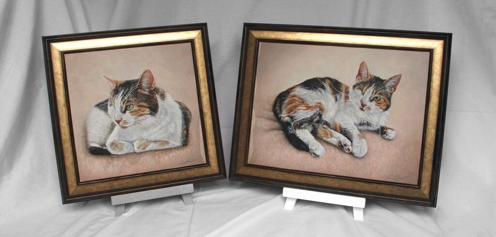 Two paintings of Mindy, a Calico shorthaired cat painted in acrylics and framed in the Windermere Bronze moulding