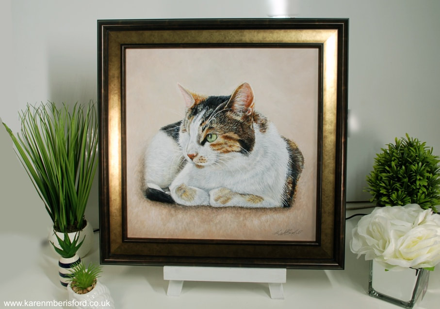 Acrylic painting of Mindy, a calico shorthaired cat in a bronze frame