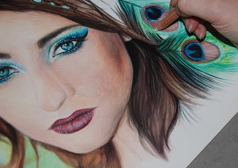 Female portrait being drawn in Coloured pencils