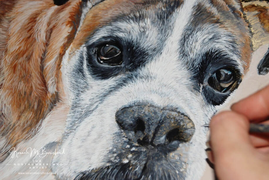Adding the fine detail to an acrylic painting of a Boxer dog